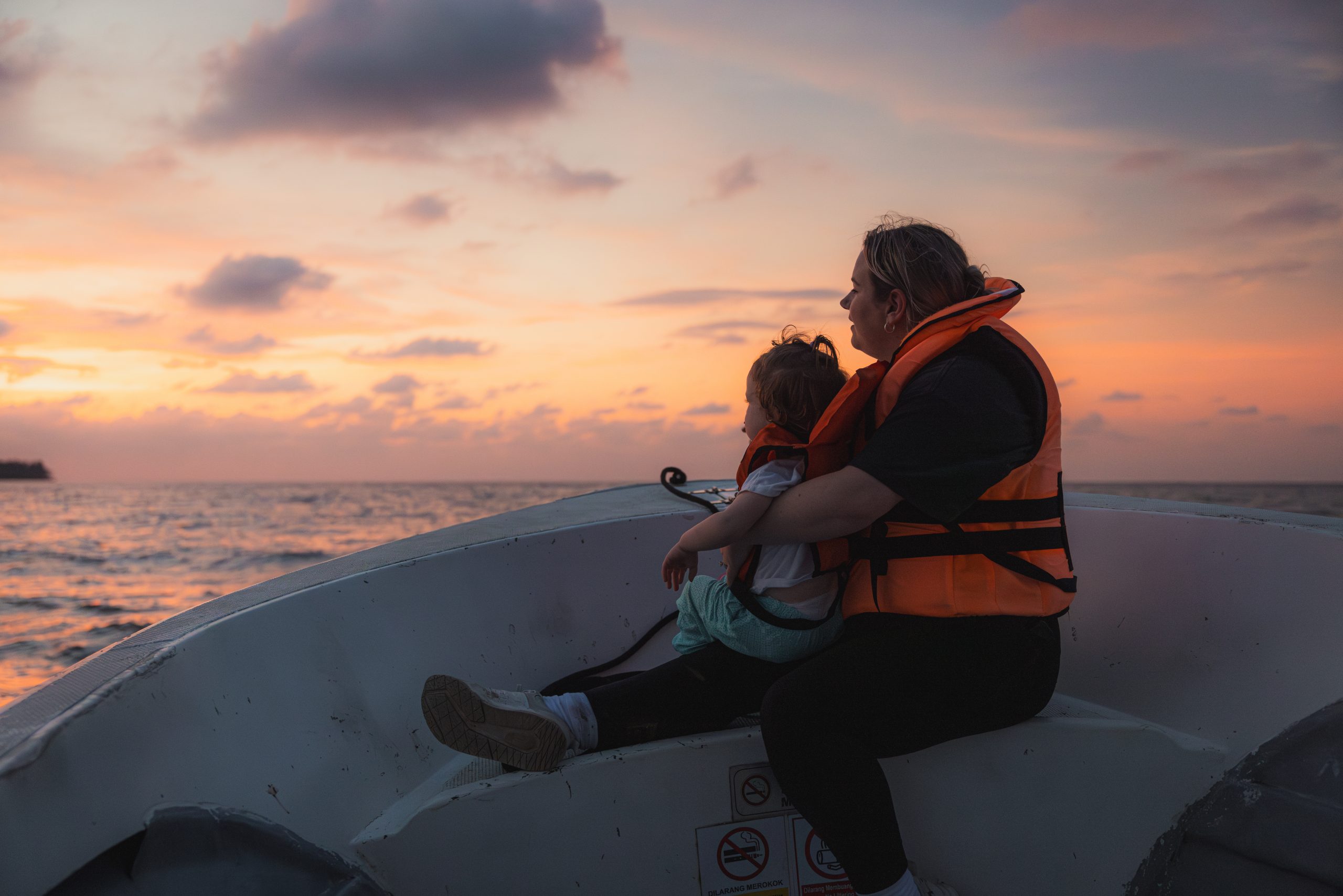 mother and toddler watching the sunset