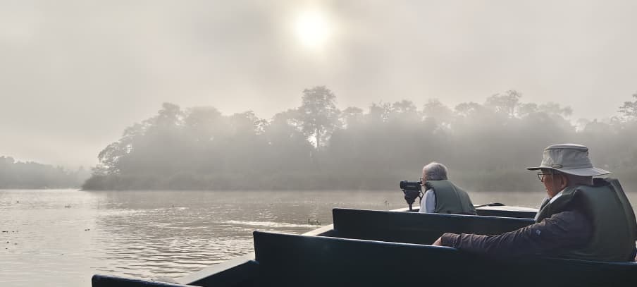 old couple during a morning river cruise in Kinabatangan
